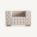 Fauteuil beige capitonné en lin design