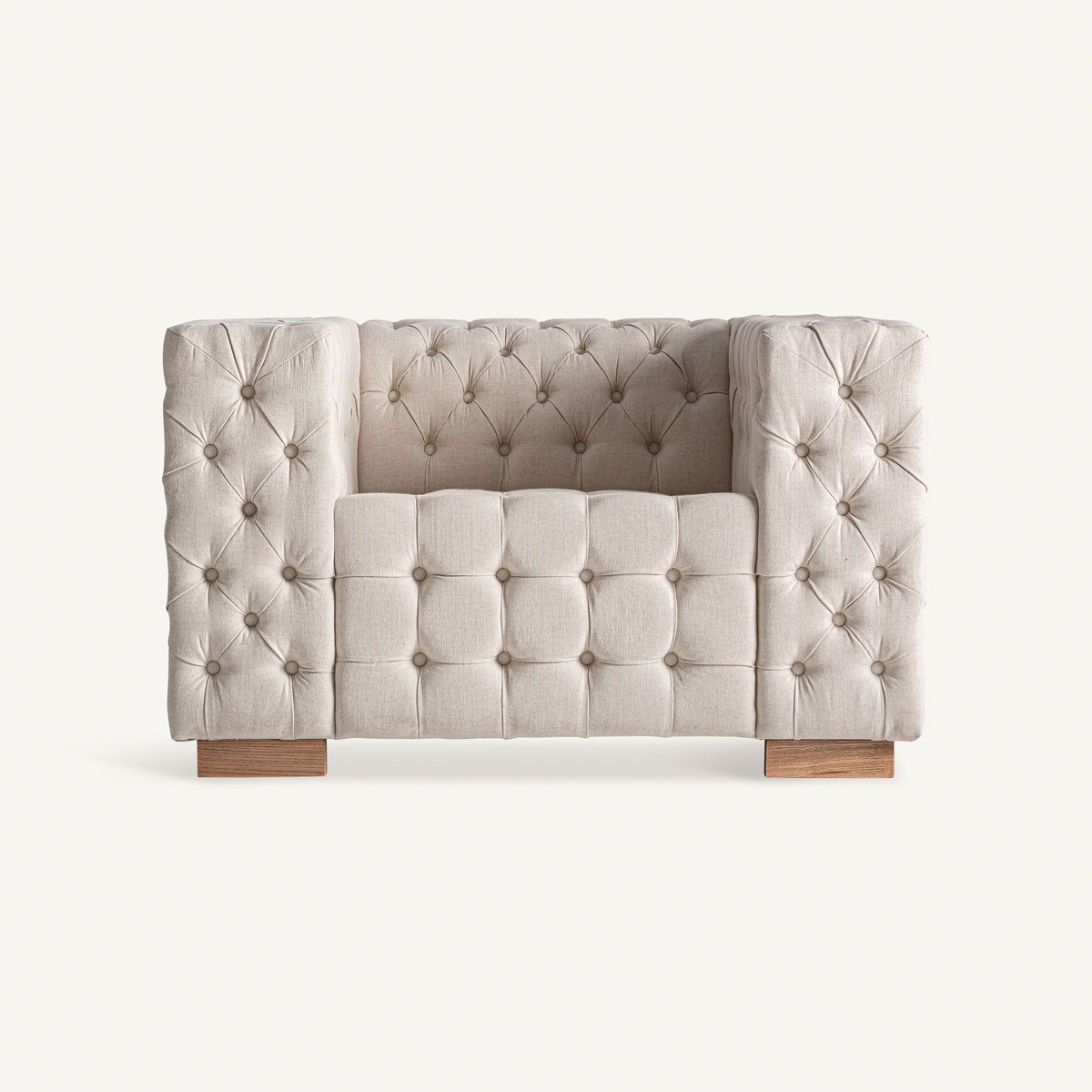 Fauteuil beige capitonné en lin design